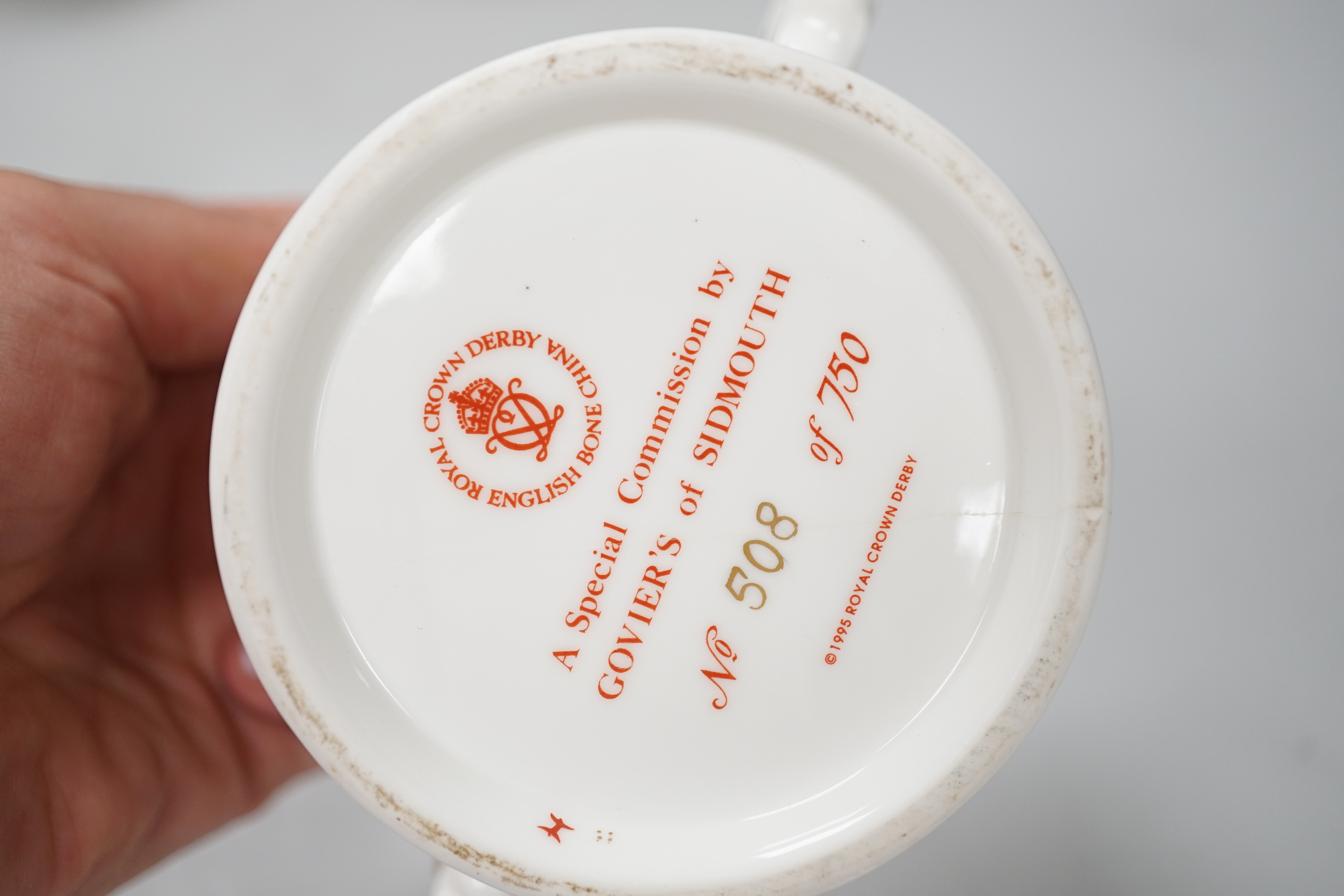 Six Royal Crown Derby Royal commemorative two handled cups